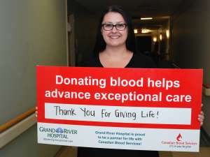 Carla Sluser With The Canadian Blood Services Sign