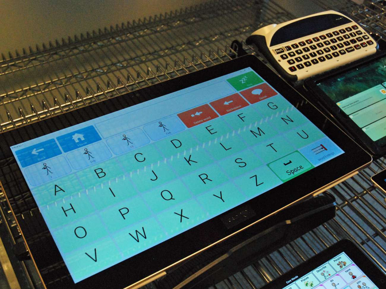 A tablet that can track a person's eye movements can be vital to supporting a client, while others may use a speech generating device (top right) to help in their communication needs