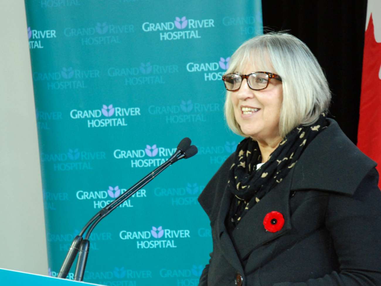 JoAnne MacPhail describes her cancer journey to guests at the announcement for additional cancer treatment equipment.