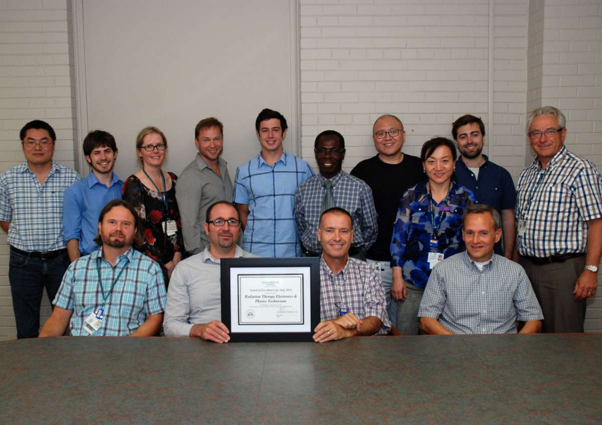 An award photo for GRH's electronics and physics technicians