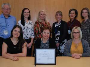Members of the clinical trials receive their award of excellence from hospital leaders