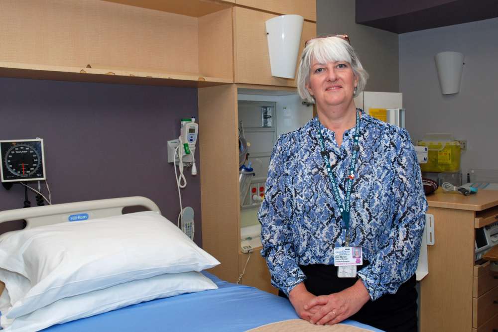 GRH childbirth clinical manager Kim Moran stands inside a patient care room.