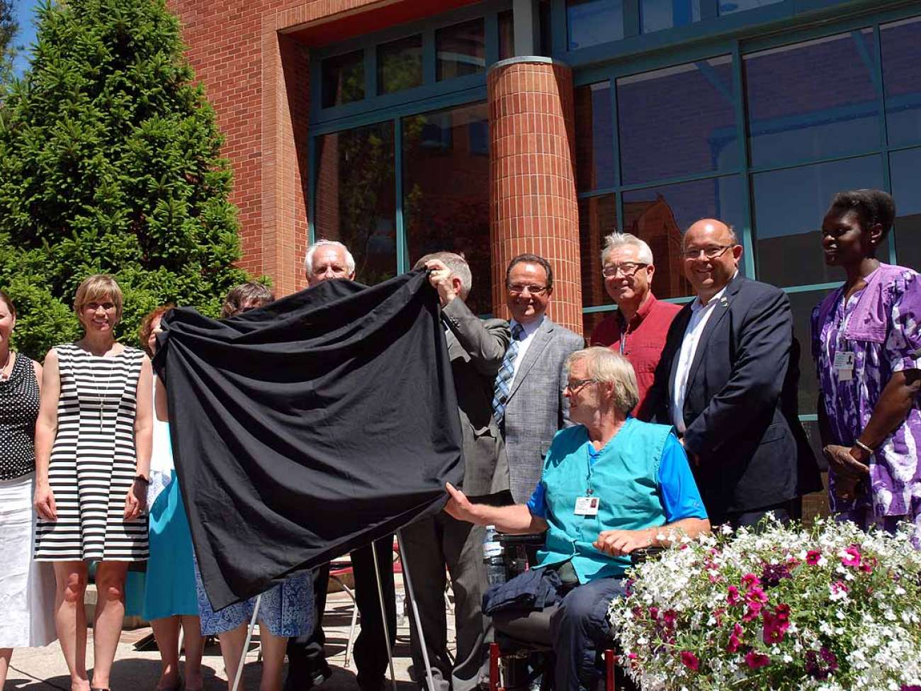 Unveiling a plaque to commemorate the century of care