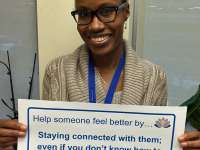 Shani's sign reads: help someone feel better by staying connected with them; even if you don't know how to help or what to say.thumbnail image.