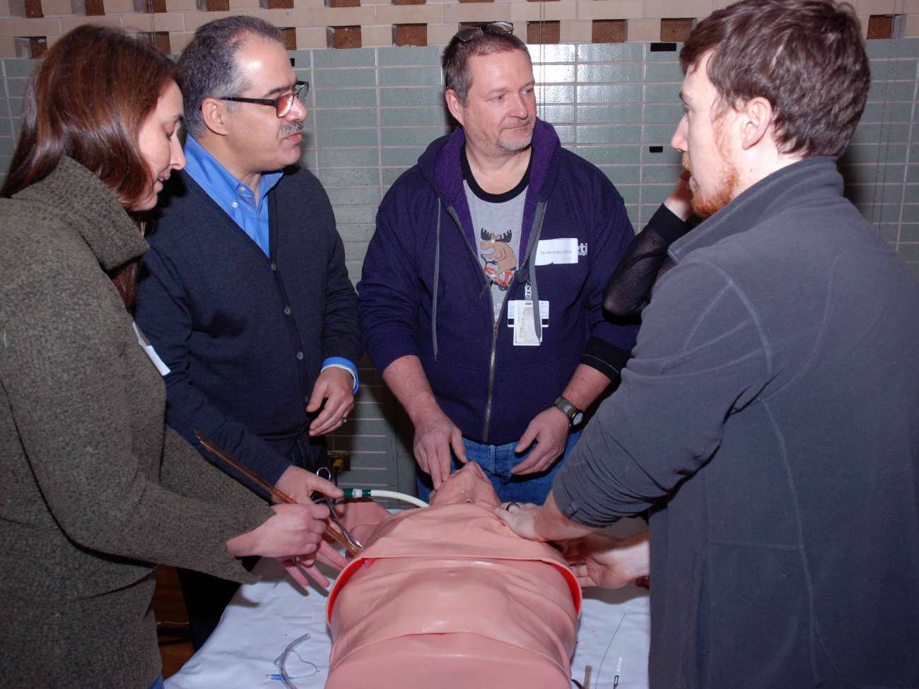 Emergency care providers in a practice session for advanced trauma life support