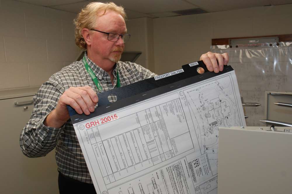 Greg Donnell reviews facilities plans in the hospital's maintenance department