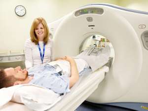 An image to a patient having a CT scan