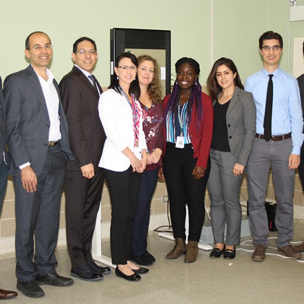 The KA Imaging and Grand River Hospital study team come together in front of the imager
