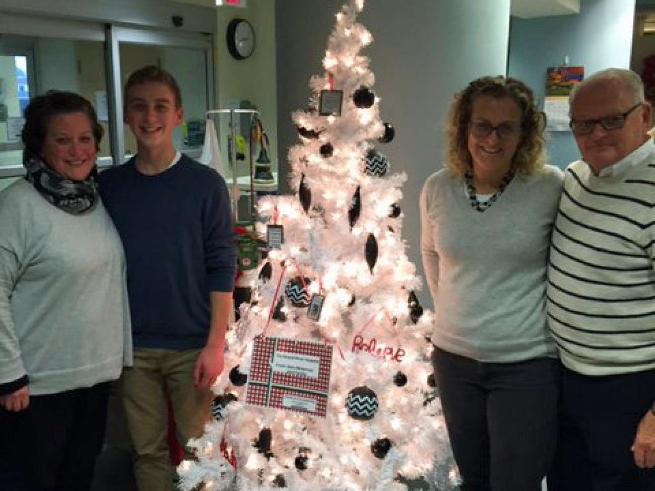 The people who made the tree happen include (left to right) Blake's mom Heather McLennan, Blake, his aunt Sara McLennan and his grandfather John McLennan