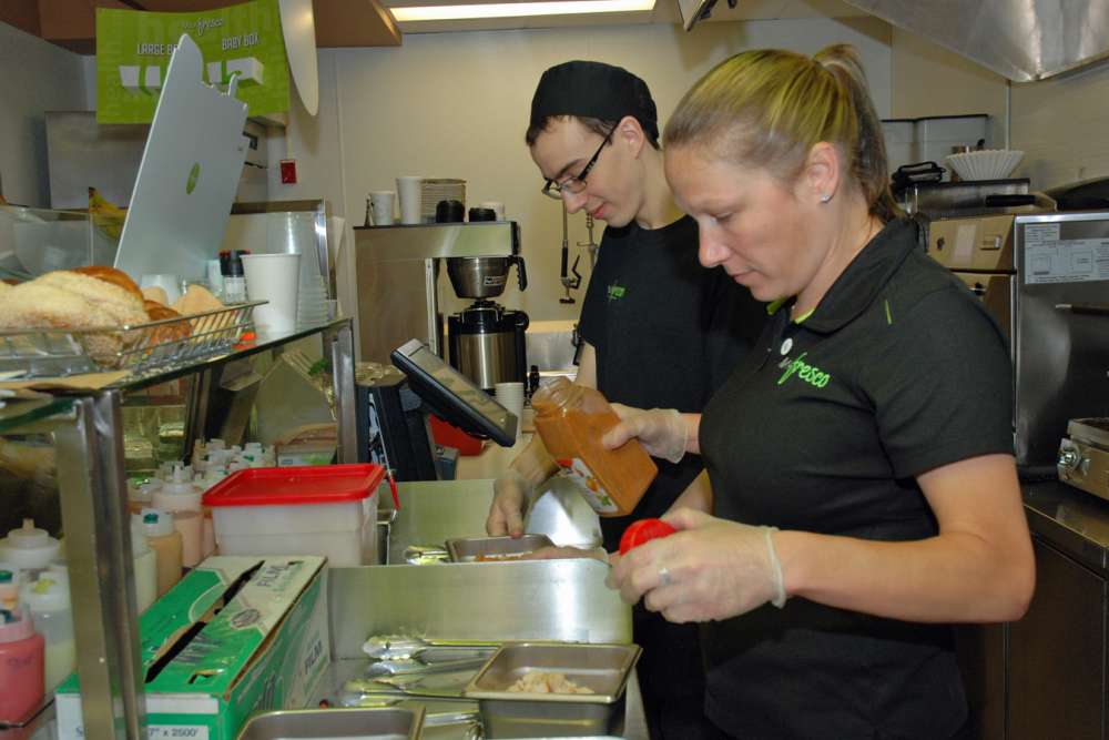 Jenn and Garrett prepare for the lunch rush.