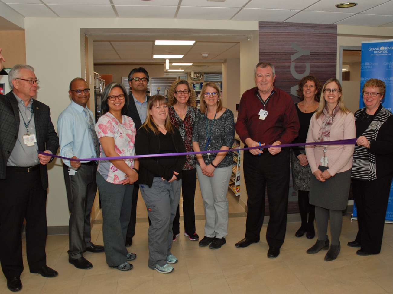 Pharmacy staff and GRH leaders cut the ribbon to officially open the renovated Health Care Centre Pharmacy.
