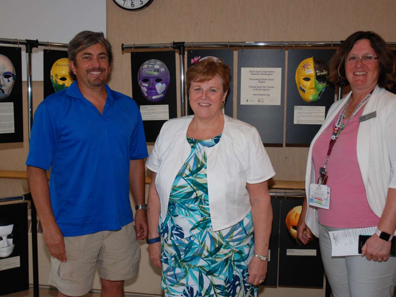 Helping to unveil the unmasking display were Dough Wetherill and Lynda Abshoff from the Brain Injury Ass'n of Waterloo Wellington, joined by GRH emergency program director Jill Schitka.