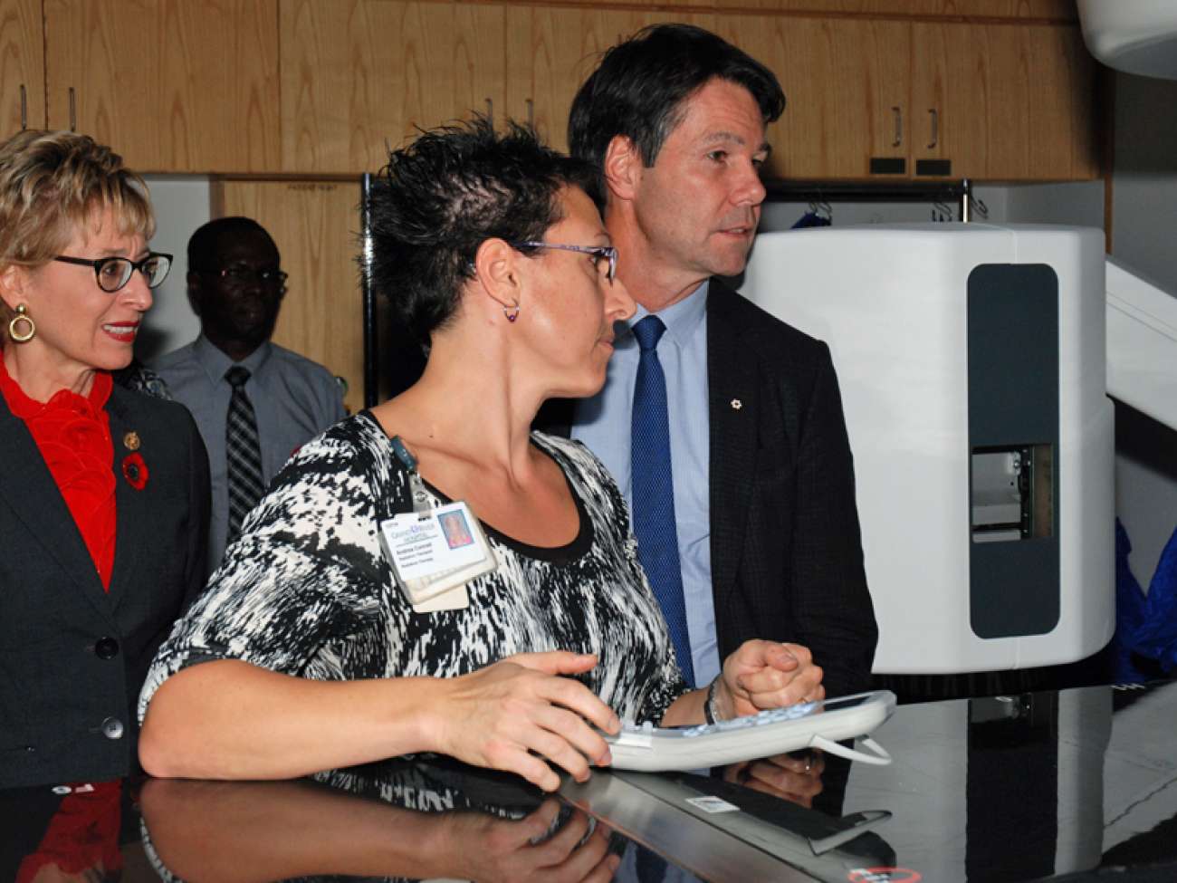 Radiation therapist Andrea Conrad shows one of the hospital's recently-acquired linear accelerators, used to treat cancer.