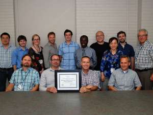 An award photo for GRH's electronics and physics technicians