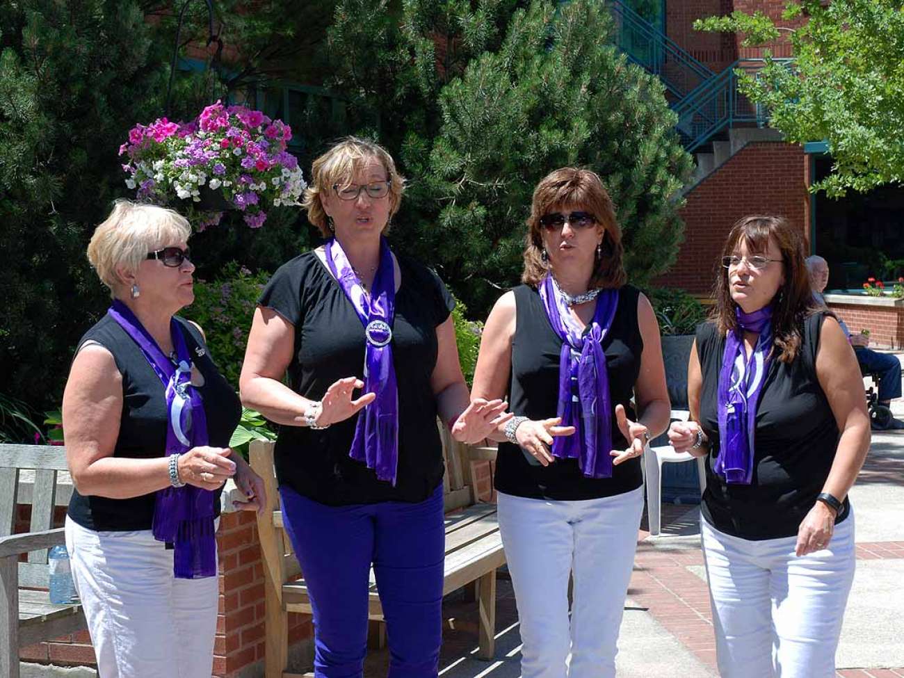 The Grand Harmony Chorus entertains guests at the celebration