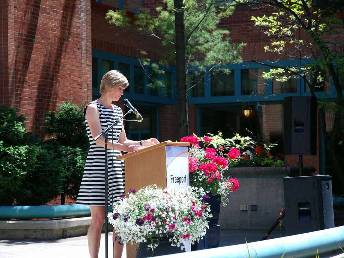 GRH Board member Tracy Elop welcomes guests to the event.