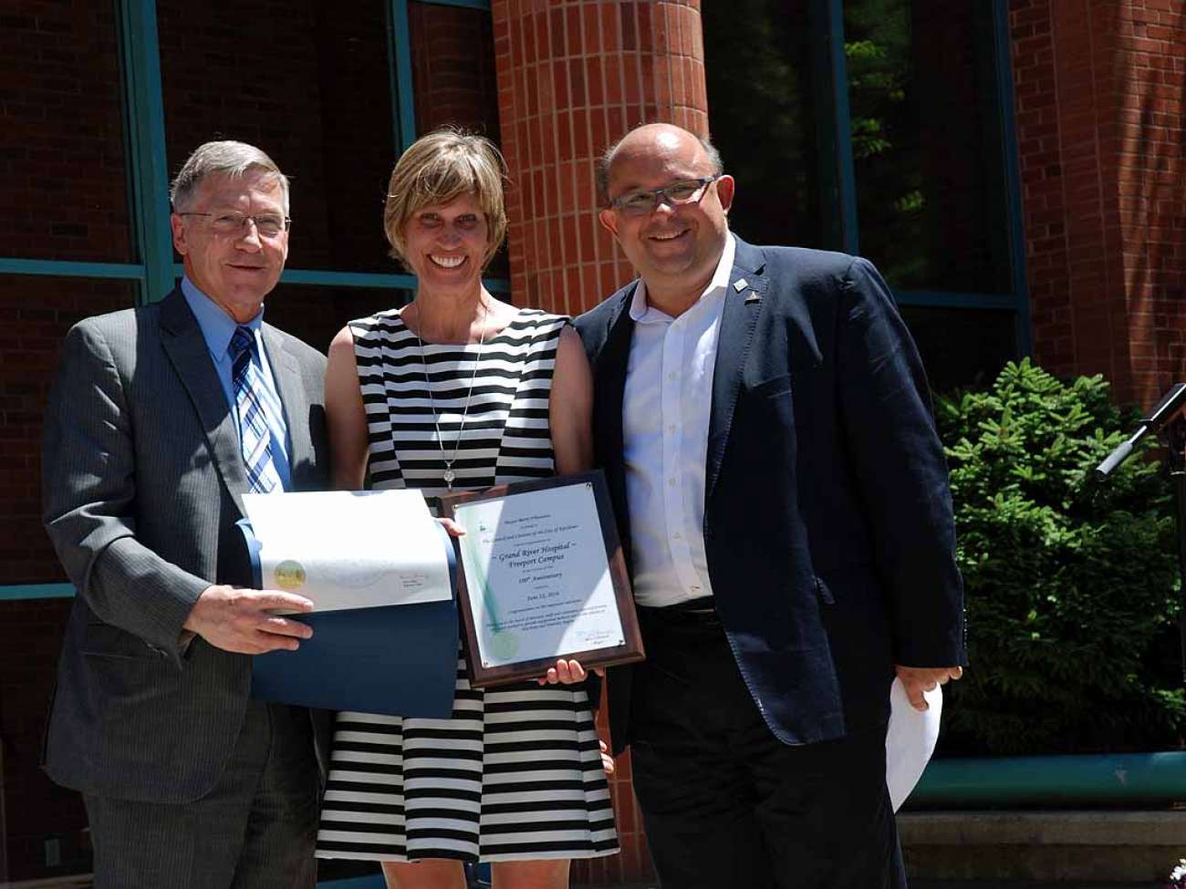 Tracy Elop receives greetings from Regional Chair Ken Seiling as well as Kitchener Mayor Berry Vrbanovic