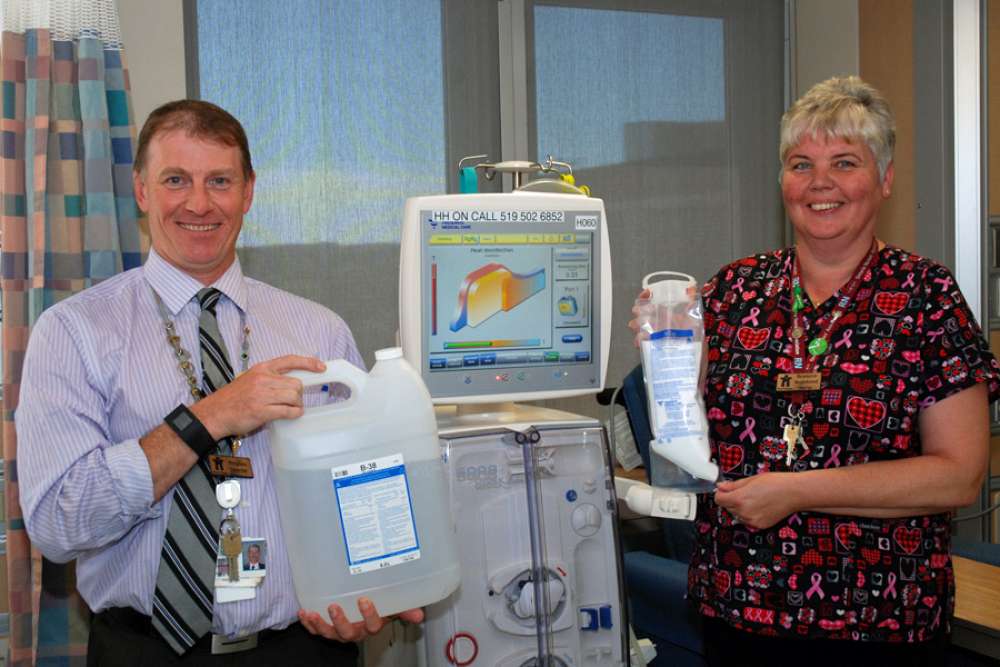 Peter Varga and Nancy Evans show the renal bi-carbonate containers and new powder plastic bags.