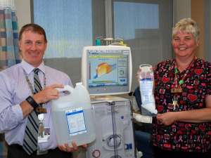 Peter Varga and Nancy Evans show the renal bi-carbonate containers and new powder plastic bags.