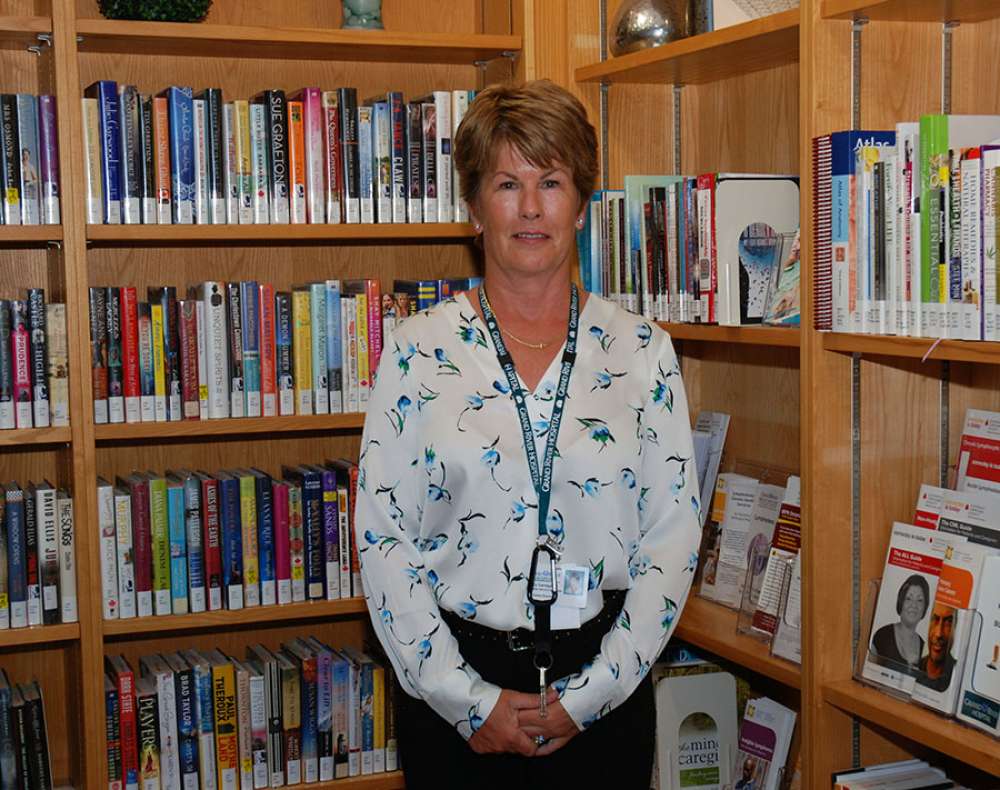 Nancy Carrique standing in the resource centre