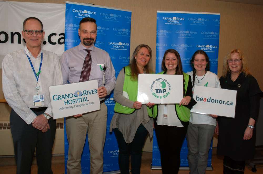 A group of people standing together at an organ donation event