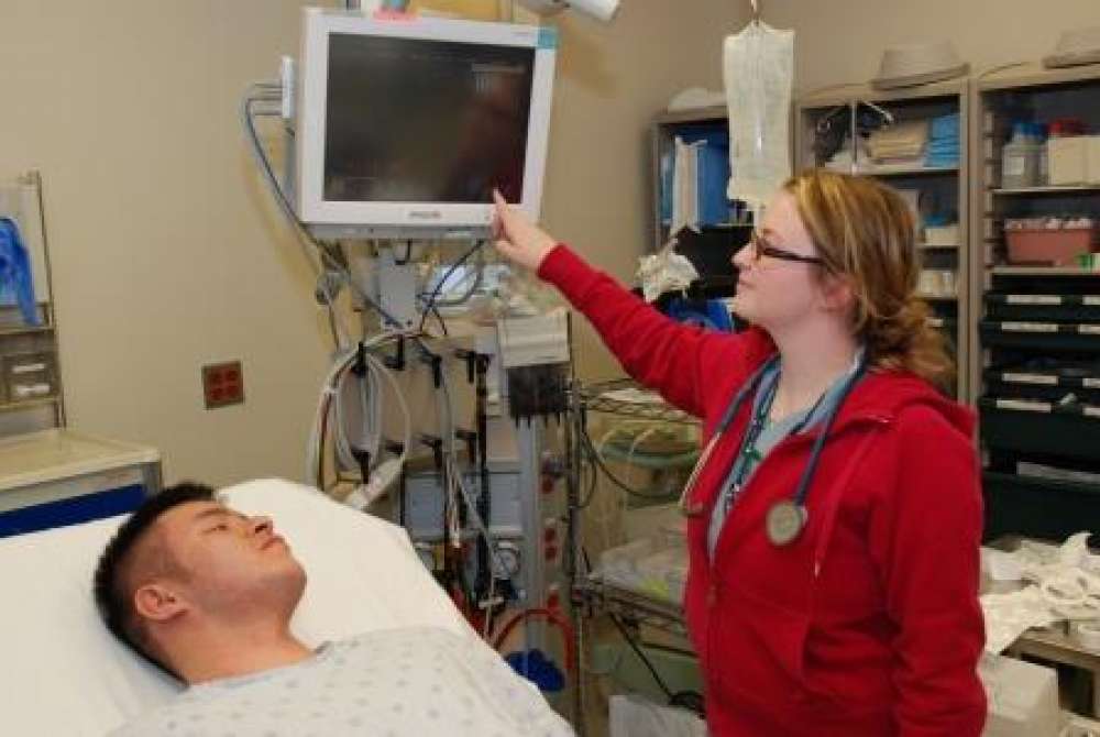 A nurse caring for an emergency patient