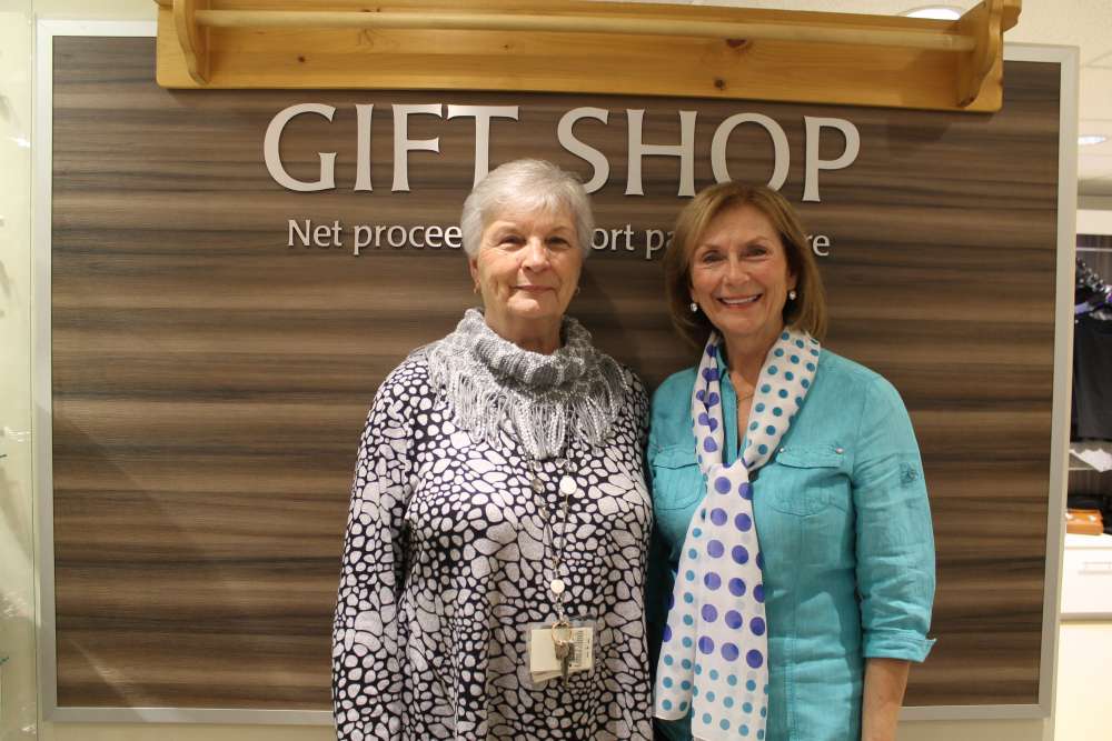 Pat and Linda standing in front of the gift shop