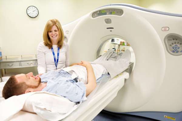 An image to a patient having a CT scan