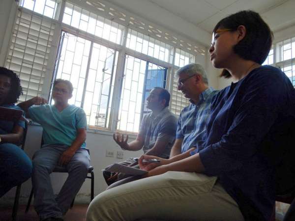 Dr. Parekh (centre) and Dr. Kuhnert (second from right) in a training session for mental health nurses.