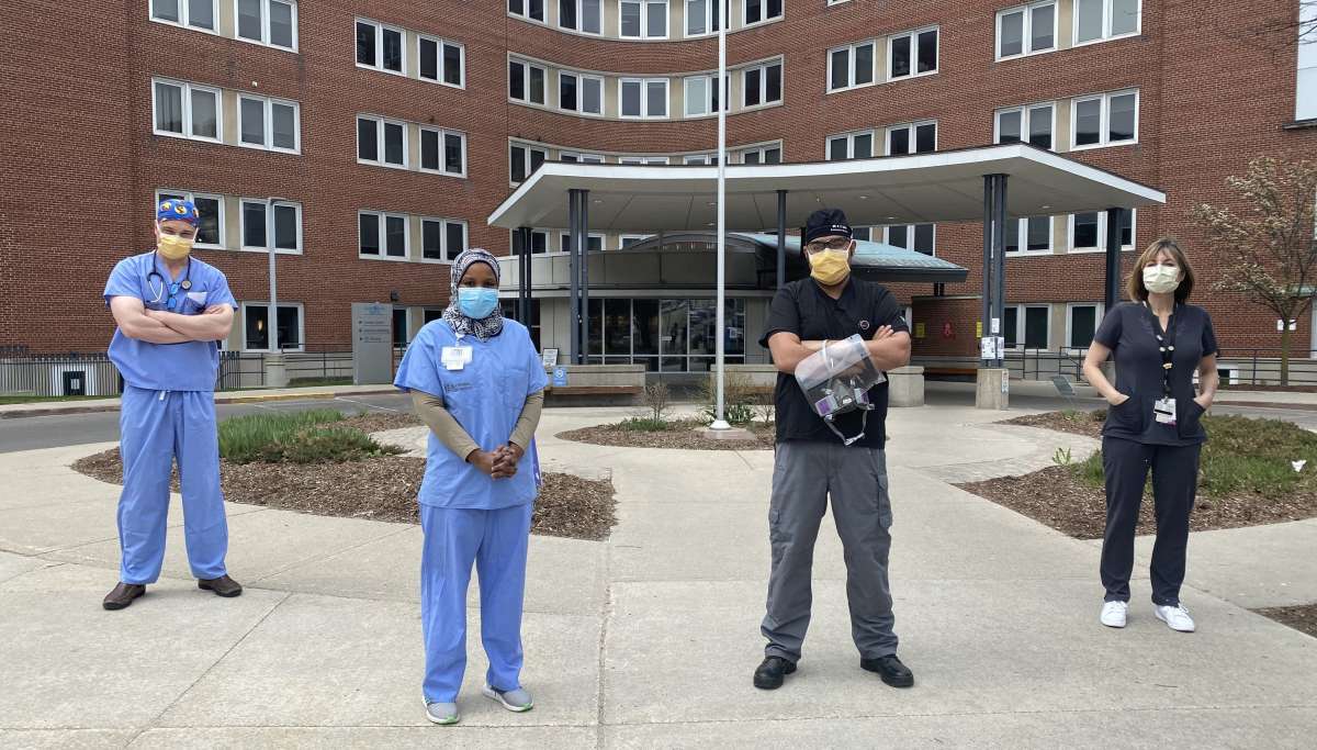 Grh Healthcare Workers Stand In Front Of Hospital