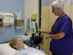 A nurse providing care for a patient