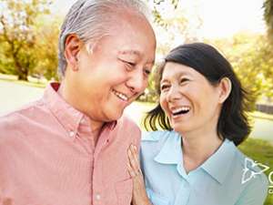 A photo of a man and a women interacting with one another