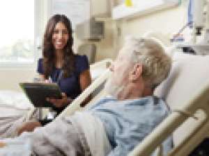 A photo of a nurse interacting with a patient