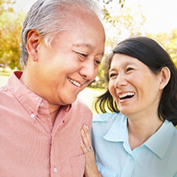 A photo of a man and a women interacting with one another