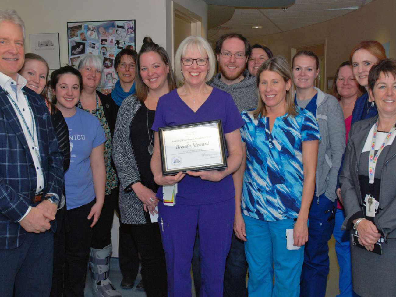 Brenda Menard's colleagues in the NICU celebrate as she's provided the employee award of excellence