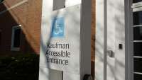 An accessible entrance sign